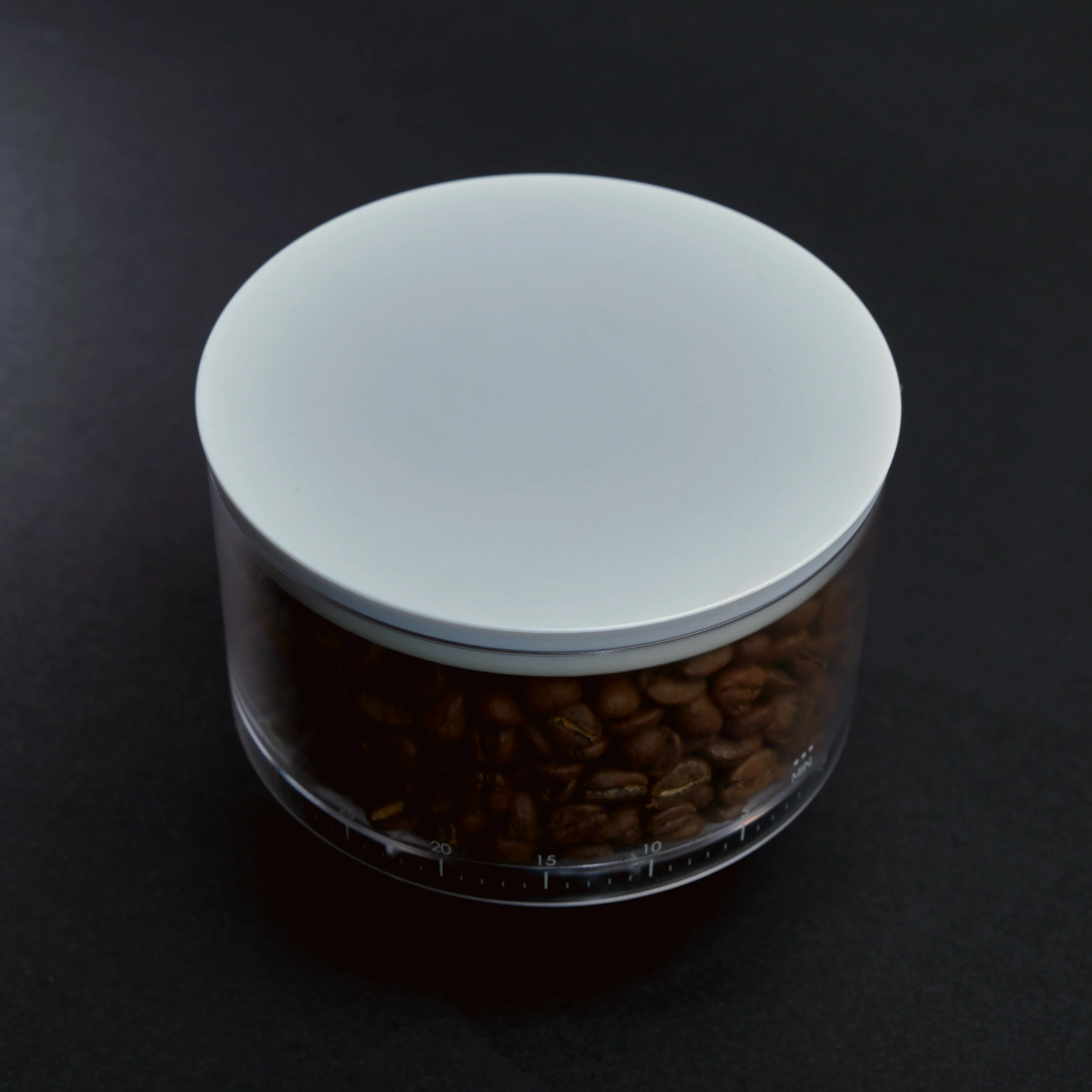 White bean hopper filled with coffee beans.
